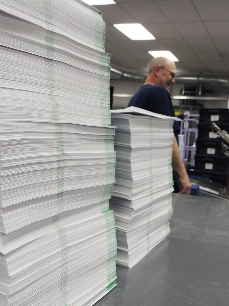 Mail moving through the finishing line on the production floor