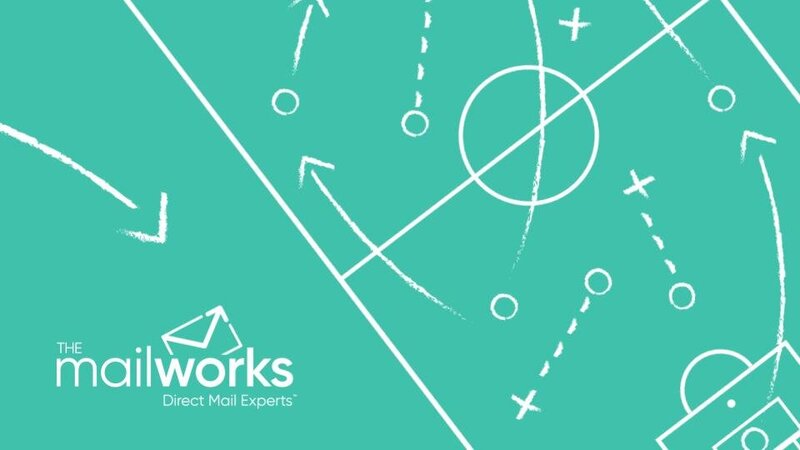 A coach's chalkboard play: arrows, routes and player marks drawn on a teal board
